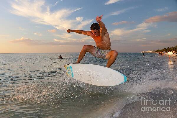 Dynamic Skimboarding at Sunset Photograph