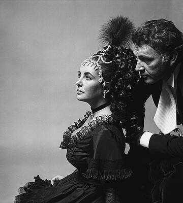 Black Background Wall Art featuring the photograph Elizabeth Taylor And Richard Burton At The Rothschild's Proust Ball by Cecil Beaton
