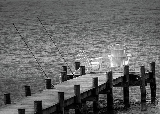 Water Wall Art featuring the photograph Empty Chairs On The Pier by Jason Fink