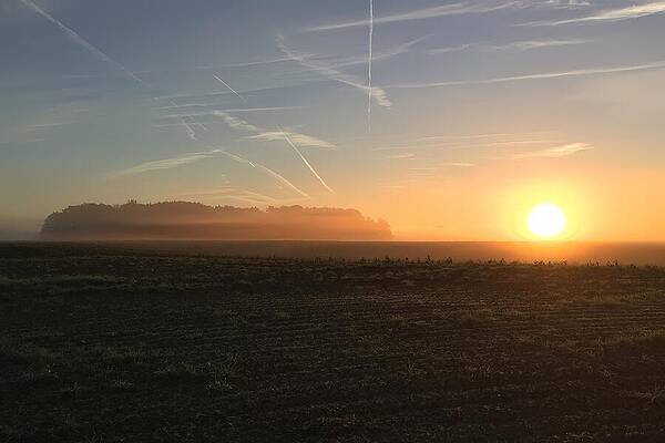 Serene Wall Art featuring the photograph Ethereal Morning Serene Sunrise Over Misty Fields by Travel Essayist