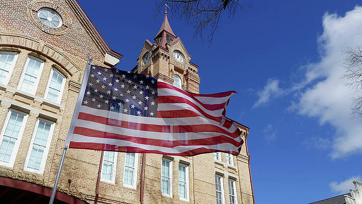 Newberry Wall Art featuring the photograph Flag In The Wind by Brian Hare