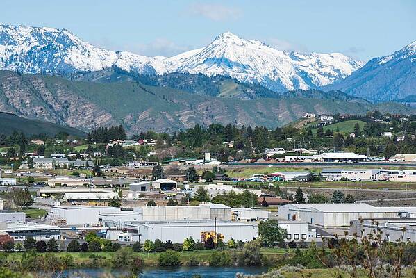 May Photograph - Fruit Plants And Snowy Peaks by Tom Cochran