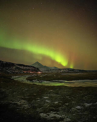 Winter Wall Art featuring the photograph Green And Red Aurora Dancing Over Rivers And Mountian Peaks Unde by Charnwood Photography Fine Art