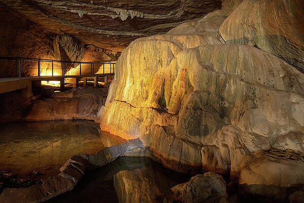 Illuminated Cave with Stalagmites Wall Art