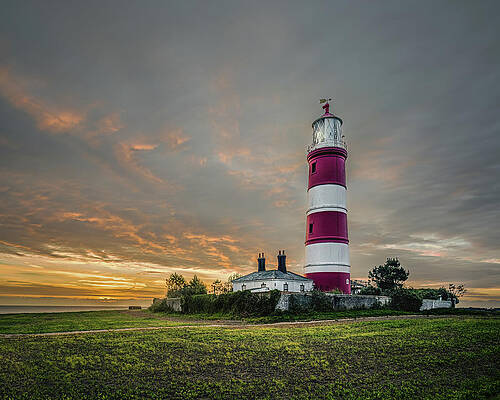 Dramatic Wall Art featuring the photograph Happisburgh Lighthouse At Dawn by Charnwood Photography Fine Art