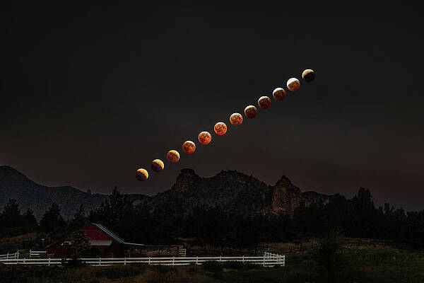 Lunar Eclipse Over Rural Landscape Photograph