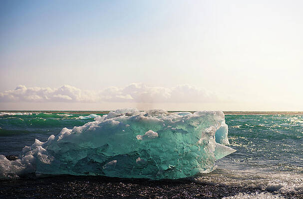 Tourism Wall Art featuring the photograph Iceberg Lying On The Diamond Beach In Jokulsarlon Glacier Lagoon, Iceland by Miroslav Liska