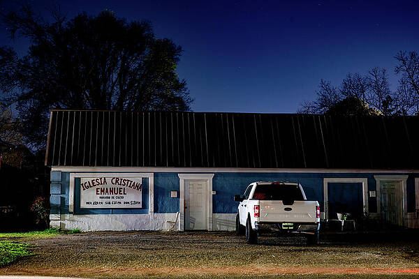Nighttime View of Blue Church Building Photograph