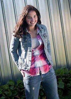 Smiling Woman in Denim Outfit Wall Art