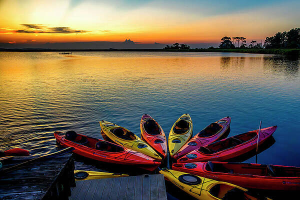 Vibrant Photograph - Kayaks Resting In The Sunset by Anthony Hightower