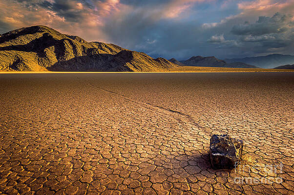 Dramatic Photograph - Last Light On The Grandstand, Racetrack Playa, Death Valley, California by Neale And Judith Clark