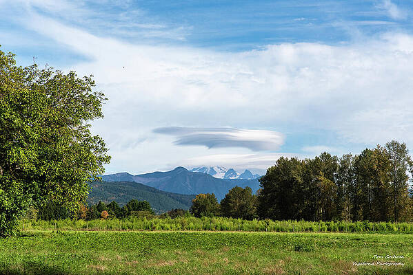 Lenticular Cloud Over Mountain Range Photograph