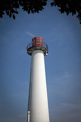 Tall Lighthouse Against Blue Sky Wall Art