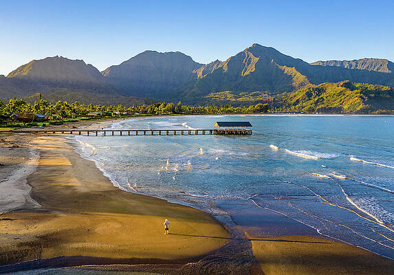 Hawaii Wall Art featuring the photograph Lone Man On The Sand Of Hanalei Beach On The Nor by Steven Heap