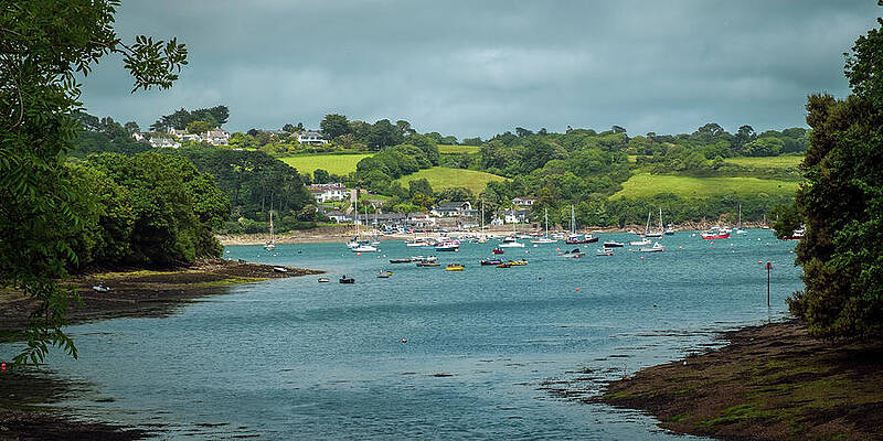 Serene River Scene with Boats Photograph