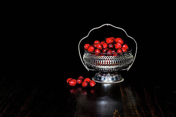 Colorful Photograph - Low Key Cranberries In Silver Basket Bowl On Brown Base by Charles Floyd