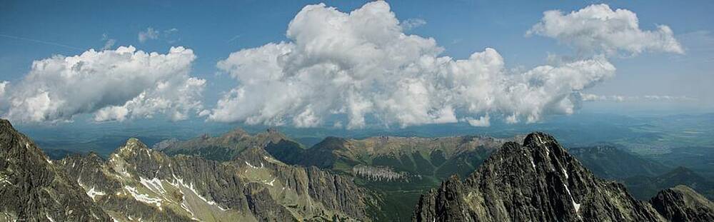Majestic Mountain Range Under Clouds Photograph