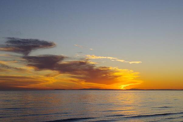 Wave Photograph - Marbella Sunset Across Calm Waves by Murray Croft