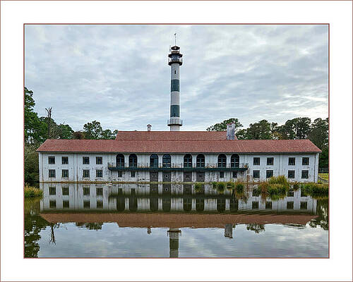 Lighthouse and Historic Building Reflection Photograph