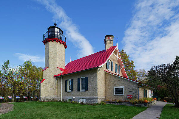 Charming Lighthouse with Red Roof Photograph