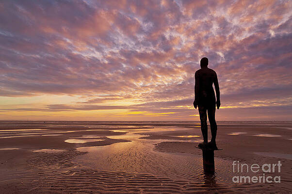 Dramatic Photograph - Metal Statues On Crosby Beach, Merseyside, England by Neale And Judith Clark