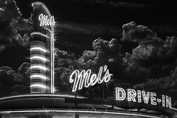 Black And White Wall Art featuring the photograph Midnight At Mel's by Bill and Linda Tiepelman