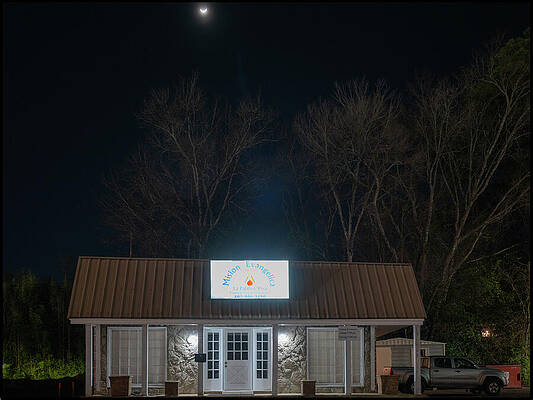 Storefront Under Moonlit Night Sky Wall Art