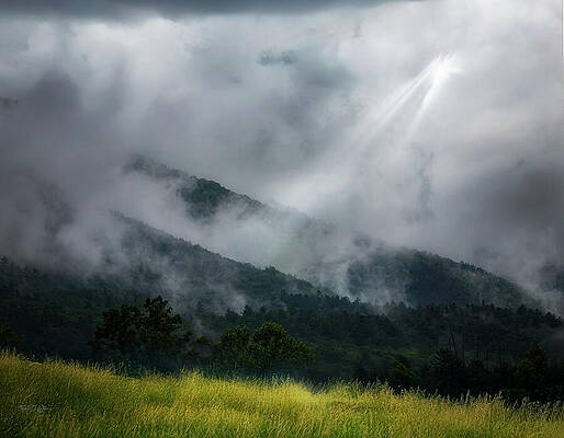 Misty Mountains with Sunbeam Photograph