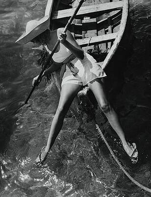 Woman in a Straw Hat on a Boat Photograph
