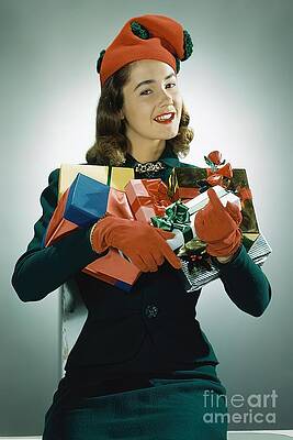 Xmas Photograph - Model Wearing Christmas Hat And Holding Gifts by John Rawlings