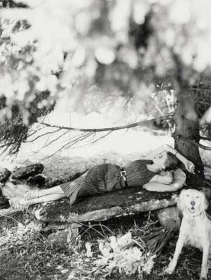 Dog Photograph - Model Reclining On Stone Bench With Dog by Karen Radkai