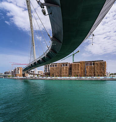 Modern Wall Art featuring the photograph Modern Apartments Alongside Dubai Canal Under Tolerance Bridge by Steven Heap