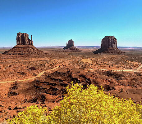Monument Valley Buttes Under Blue Sky Photograph