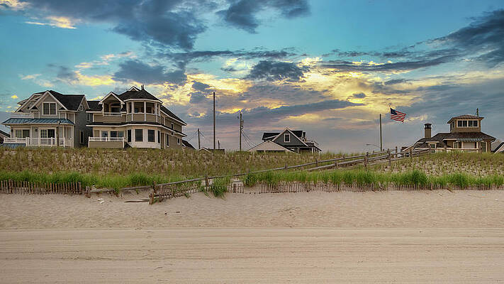 Summer Wall Art featuring the photograph Moody Skies Behind The Beach Houses by Matthew DeGrushe
