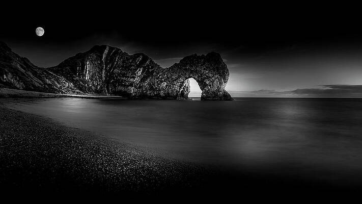 Landscape Photograph - Moon Over Durdle Door by Chris Boulton