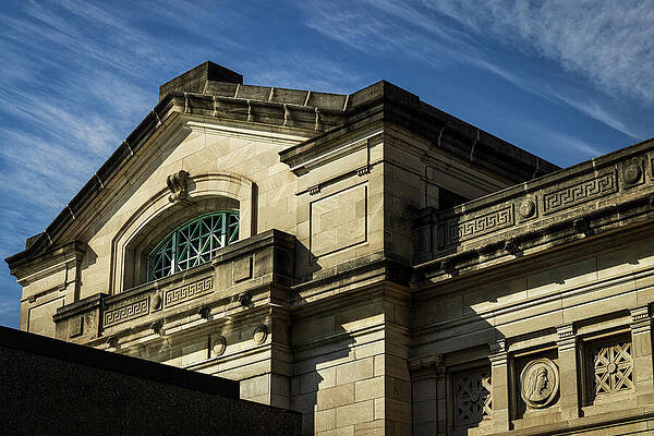 Historic Building Facade under Blue Sky Photograph
