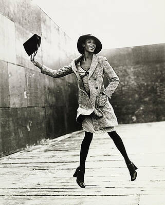Elegant Woman Leaping with Hat Photograph