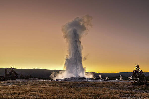 National Parks Wall Art featuring the photograph Old Faithful Sunset by Tim Lyden