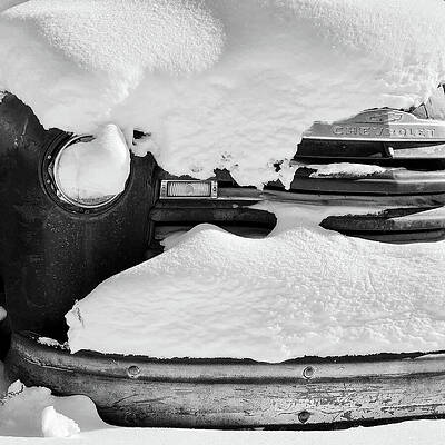 Wall Art featuring the photograph Old Rusty Chevrolet Covered By Snow In Montana Black And White by Tatiana Travelways