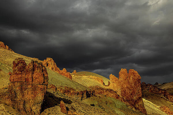 Mountain Wall Art featuring the photograph Ominuous Outcrops by Tim Lyden