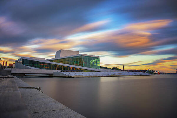 Wall Art featuring the photograph Oslo Opera House At Sunset With Calm Fjord Waters And Colorful Sky, Norway. by Miroslav Liska
