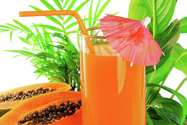 Summer Wall Art featuring the photograph Papaya Fruit And Glass Of Juice And Exotic Leaves by Severija Kirilovaite