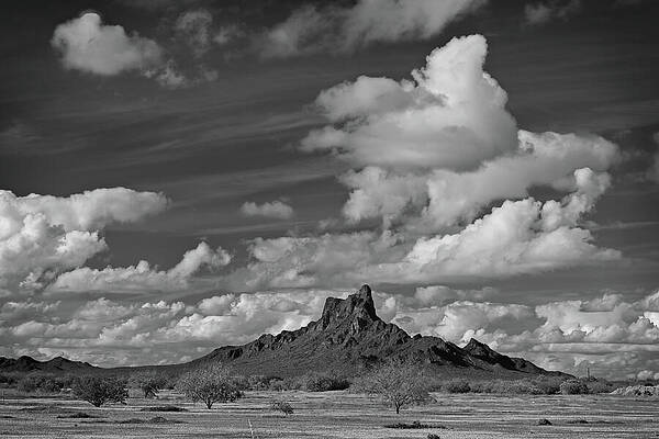 Dramatic Clouds Over Desert Mountain Photograph