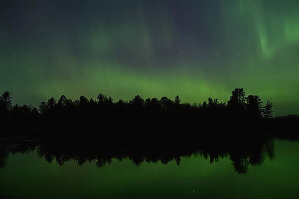 Wall Art featuring the photograph Pickerel Lake Aurora Reflection by Dale Kauzlaric
