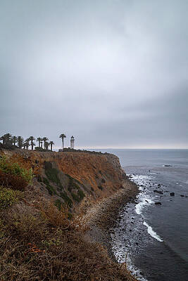 Lighthouse Overlooking Rocky Shoreline Wall Art
