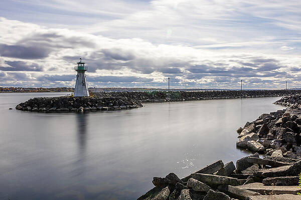 Lighthouse by the Shoreline Photograph