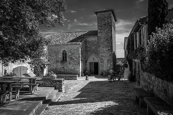 Stone Church in Sunlit Courtyard Photograph