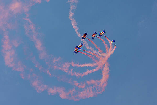 Parachutists Displaying Colorful Trails Photograph