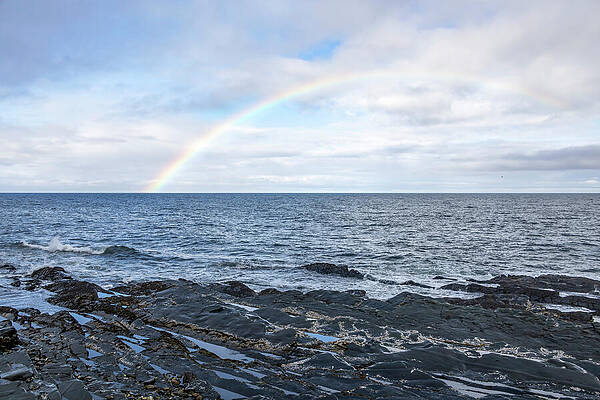 Rainbow Over Rocky Seashore Photograph