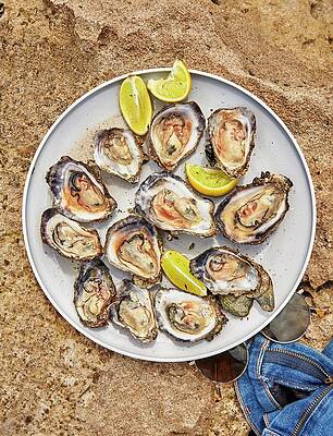 Plate Wall Art featuring the photograph Raw Local Oysters by Emma Fishman